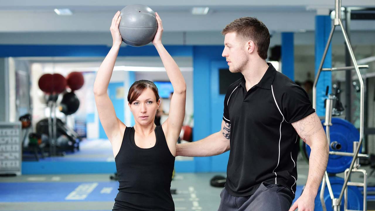Personal trainer with client Personal trainer with client