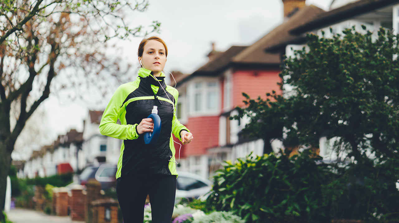 WOMAN JOGGING ALONE WOMAN JOGGING ALONE